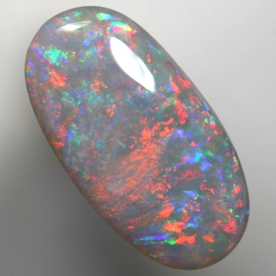 SOLID SEMI BLACK OPAL Sparkles of fire red and green over mauve